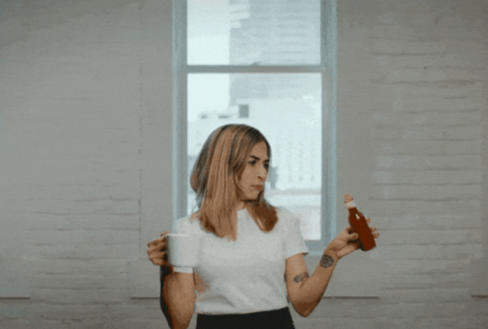 GIRL HOLDING HOT UJO SAUCE AND COFFEE